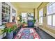 Bright sunroom with large windows, slate floors, and stylish decor at 976 Blue Ridge Ne Ave, Atlanta, GA 30306