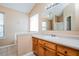 Bathroom features a vanity with a sink and mirror, providing a functional space at 10670 Day Lily Dr, Hampton, GA 30228