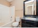 Bathroom showcasing a vanity, toilet, and bathtub, blending style and function at 10670 Day Lily Dr, Hampton, GA 30228