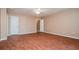 Bright and airy bedroom features hardwood floors, creating a cozy and inviting atmosphere at 10670 Day Lily Dr, Hampton, GA 30228
