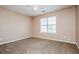 Cozy bedroom with a ceiling fan and a window, ideal for relaxation at 10670 Day Lily Dr, Hampton, GA 30228