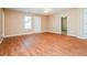 Spacious bedroom with hardwood flooring and natural light, perfect for relaxation and comfort at 10670 Day Lily Dr, Hampton, GA 30228