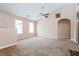 Large, comfortable living room with vaulted ceilings, providing an airy and open atmosphere at 10670 Day Lily Dr, Hampton, GA 30228