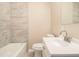 Updated bathroom features a tiled shower and a new toilet at 1207 Ellington Dr, Morrow, GA 30260