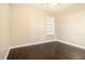 Neutral bedroom with built-in shelves and hardwood flooring at 1207 Ellington Dr, Morrow, GA 30260