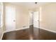 Neutral bedroom features a ceiling fan, hardwood floors, and bright natural light at 1207 Ellington Dr, Morrow, GA 30260