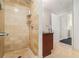 Bathroom featuring tiled walk-in shower and vanity with granite countertop at 195 14Th Ne St # 1908, Atlanta, GA 30309