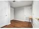 Hallway with hardwood floors and multiple doors in neutral, freshly painted colors at 195 14Th Ne St # 1908, Atlanta, GA 30309