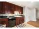 Kitchen with dark cabinets, granite countertops, stainless steel dishwasher and tile flooring at 195 14Th Ne St # 1908, Atlanta, GA 30309