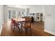 Bright living room with hardwood floors, dining table, sofa, shelving and large windows at 195 14Th Ne St # 1908, Atlanta, GA 30309