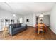 Spacious living area with hardwood floors, sofa, shelving and dining set at 195 14Th Ne St # 1908, Atlanta, GA 30309