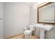 Powder room featuring pedestal sink, framed mirror, and neutral color at 195 14Th Ne St # 1908, Atlanta, GA 30309