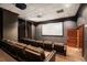 Private movie theater room with comfortable leather seating and a large screen for an immersive viewing experience at 195 14Th Ne St # 1908, Atlanta, GA 30309