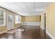 Finished basement featuring new flooring, an exterior door, and white trim at 10660 Thatcher Way, Johns Creek, GA 30097