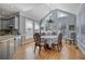 Bright dining area with large windows and elegant chandelier at 10660 Thatcher Way, Johns Creek, GA 30097