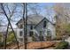 Charming two-story home with well-manicured lawn and mature trees at 10660 Thatcher Way, Johns Creek, GA 30097