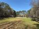 Expansive community recreation field, fenced for safety and perfect for various outdoor activities at 10660 Thatcher Way, Johns Creek, GA 30097