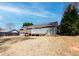 Backyard of home featuring a wooden deck, gray siding, bright blue sky, and nice green tree at 11555 Brown Bridge Rd, Covington, GA 30016
