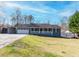 Charming single story home featuring an attached garage, a front porch, and a paved driveway at 11555 Brown Bridge Rd, Covington, GA 30016