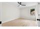 Bright bedroom with a modern ceiling fan and beautiful light wood flooring and a window at 1980 Oakdale Se Ct, Smyrna, GA 30082