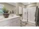 Stylish bathroom with double sinks, ample counter space, a walk-in shower, and contemporary design elements at 2272 Jamin Bnd # 13, Lithonia, GA 30058