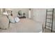 Comfortable bedroom with modern décor, calming colors, a round decorative mirror, and ample natural light at 2272 Jamin Bnd # 13, Lithonia, GA 30058