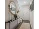 Inviting foyer with elegant console table, decorative mirror, hardwood floors, and soft lighting at 2272 Jamin Bnd # 13, Lithonia, GA 30058