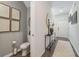 Cozy entryway adjacent to a half bath with sleek decor and hardwood flooring at 2272 Jamin Bnd # 13, Lithonia, GA 30058