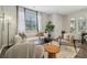 Inviting living room with large window, stylish seating, and a modern floor lamp at 2272 Jamin Bnd # 13, Lithonia, GA 30058