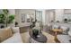 Stylish living room with views of dining area and modern kitchen at 2272 Jamin Bnd # 13, Lithonia, GA 30058