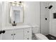 Bathroom featuring a vanity, toilet and a tiled walk-in shower with black fixtures at 4378 Glenwood Pkwy, Decatur, GA 30032