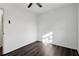 A bedroom with dark wood flooring, ceiling fan, and neutral walls at 4378 Glenwood Pkwy, Decatur, GA 30032