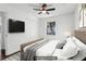 Staged bedroom featuring hardwood floors, a ceiling fan, and natural light at 4378 Glenwood Pkwy, Decatur, GA 30032