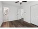 Bedroom with hardwood floors leading to bathroom and closet space at 4378 Glenwood Pkwy, Decatur, GA 30032