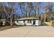 Charming home with a white exterior, well-maintained yard, and inviting curb appeal at 4378 Glenwood Pkwy, Decatur, GA 30032