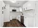 A modern kitchen features white cabinets and stainless steel appliances at 4378 Glenwood Pkwy, Decatur, GA 30032