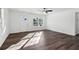 Bright and airy living room with sleek flooring, a ceiling fan, and large windows at 4378 Glenwood Pkwy, Decatur, GA 30032