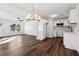 Open concept living space with modern chandelier and stainless appliances at 4378 Glenwood Pkwy, Decatur, GA 30032