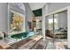 Large main bathroom with a jacuzzi tub, large window and glass enclosed shower area at 561 Culberson Sw St, Atlanta, GA 30310