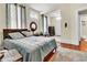 Bright bedroom with a large bed, wooden floors, closet, and ensuite bathroom at 561 Culberson Sw St, Atlanta, GA 30310