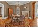 Elegant dining room featuring hardwood floors, a chandelier, and comfortable seating at 561 Culberson Sw St, Atlanta, GA 30310