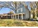 Charming blue two-story home with a welcoming front porch and well-maintained lawn at 561 Culberson Sw St, Atlanta, GA 30310