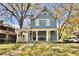 Inviting two-story home with a spacious porch and a well-manicured front lawn at 561 Culberson Sw St, Atlanta, GA 30310