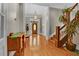 Grand foyer with hardwood floors, staircase, and decorative lighting at 561 Culberson Sw St, Atlanta, GA 30310