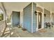 Spacious front porch featuring stylish slate tile flooring, a seating area, and charming decor at 561 Culberson Sw St, Atlanta, GA 30310