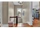 Hallway with wood floors, a window, and stairs leading to another floor at 561 Culberson Sw St, Atlanta, GA 30310