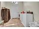 Functional laundry room with a washer, dryer, storage and ample space at 561 Culberson Sw St, Atlanta, GA 30310
