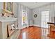 Cozy living room with hardwood floors, a fireplace, and large windows with sheer curtains at 561 Culberson Sw St, Atlanta, GA 30310