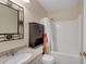 This bathroom features a vanity, toilet, and shower/tub combo, providing a functional and clean space at 1050 Sunny Field Ct, Lawrenceville, GA 30043