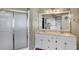 Bathroom vanity features double sinks, shower, and large mirror at 1050 Sunny Field Ct, Lawrenceville, GA 30043
